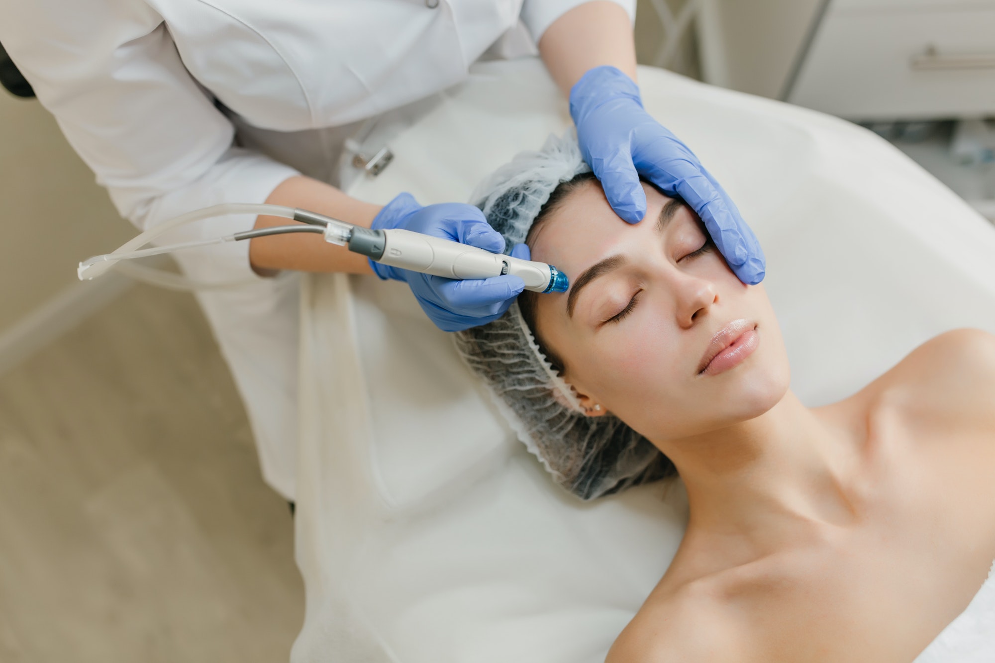 view-from-above-rejuvenation-of-beautiful-woman-enjoying-cosmetology-procedures-in-beauty-salon-der.jpg